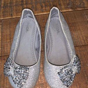 Silver metallic flats with bow detail